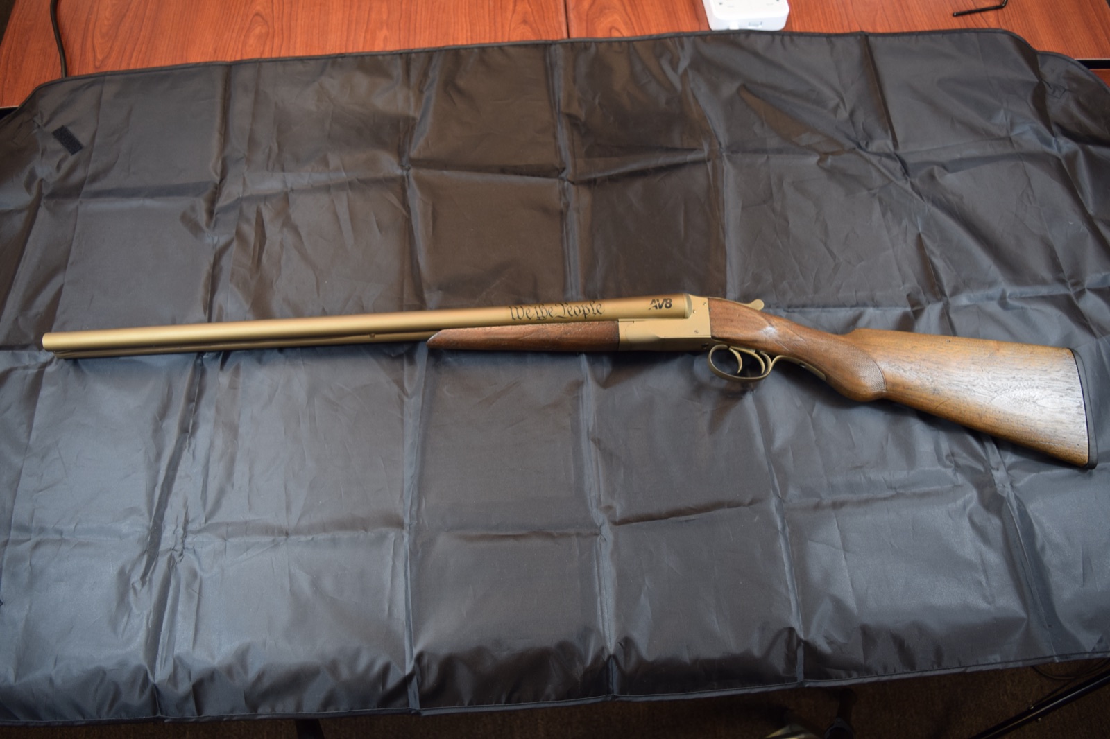Enders Royal antique double barrel shotgun with gold Cerakote and We The People laser engraving